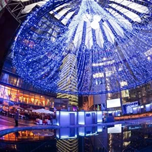 Futuristic design of the Sony Center in Potsdamer Platz, illuminated at Christmas