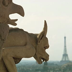Gargoyles on Notre Dame Cathedral, and beyond, the Eiffel Tower, Paris, France, Europe