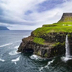 Gasadalur waterfall into the ocean, Vagar, Faroe Islands, Denmark, Europe