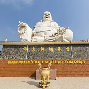 Giant Buddha statue at Vinh Trang Pagoda, My Tho, Vietnam, Indochina, Southeast Asia