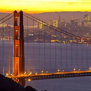 The Golden Gate Bridge and San Francisco skyline at sunrise, San Francisco, California, United States of America, North America