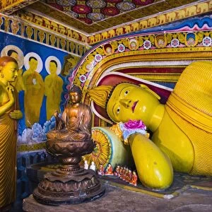 Golden reclining Buddha at Temple of the Tooth (Temple of the Sacred Tooth Relic) in Kandy, UNESCO World Heritage Site, Sri Lanka, Asia