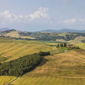 Green rolling hills and farm houses of Crete Senesi (Senese Clays), Province of Siena