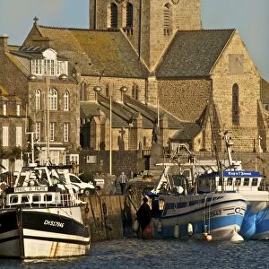 Harbour and fishing boats with houses and church in the background, Barfleur