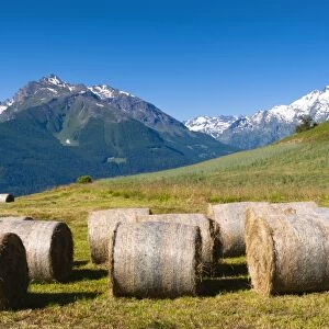 Hay bales, Grivola and Grand Nomenon mountains, Aosta Valley, Italian Alps, Italy, Europe