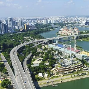 High view over Singapore with the Singapore Flyer ferris wheel and ECP expressway