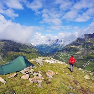 Hiker and camp site, Sustenpass (Susten Pass), Swiss Alps, Switzerland, Europe
