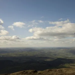 A hiker walks north from Hay Bluff, above Hay-on-Wye, Brecon Beacons National Park