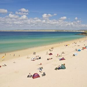 Holidaymakers and tourists sunbathing on Porthminster beach, St. Ives (Pedn Olva)
