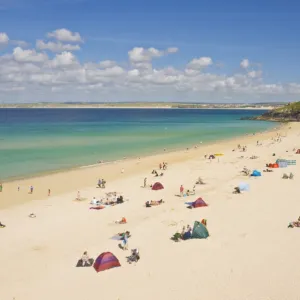 Holidaymakers and tourists sunbathing on Porthminster beach, St. Ives (Pedn Olva)