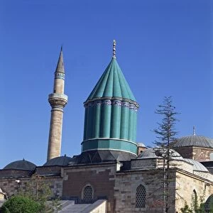 Horse and cart passes the Mevlana Tekke Museum with