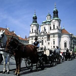 Horse drawn carriage at Old Town Square and St. Nicholas church, Stare Mesto