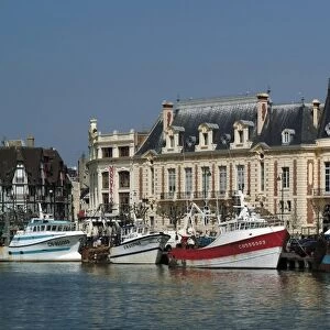 Hotel de Ville (town hall) and fishing boats at mouth of the River Touques