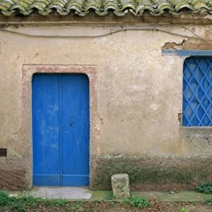 House with blue door and window