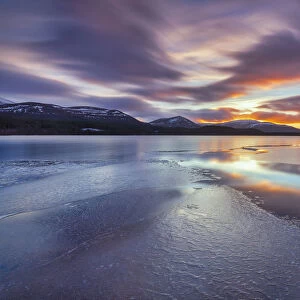 Ice sheets and sunset at Loch Morlich, Glenmore, Scotland, UK