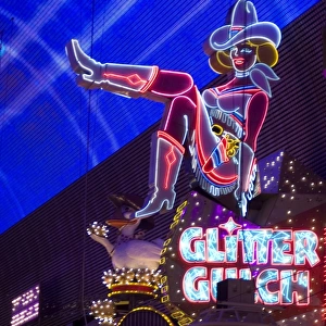 Illuminated girl on sign at Glitter Gulch, Fremont Street, Las Vegas, Nevada