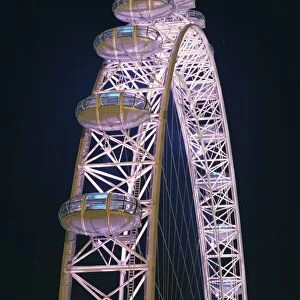 Illuminated by moving coloured lights, London Eye, architects Marks Barfield