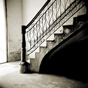 Image taken with a Holga medium format 120 film toy camera of stairs with ornate ironwork inside apartment building, Cienfuegos, Cuba, West Indies