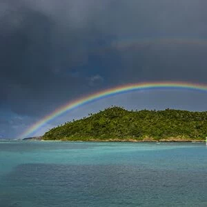 Incredible rainbow over an islet off Ofu Island, Manua Island group, American Samoa, South Pacific, Pacific