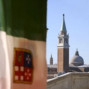 Italian flag and the campanile of San Marco (St