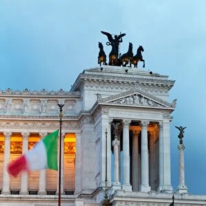 Italian flag in front of the Victor Emmanuel Monument at night, Rome, Lazio, Italy, Europe