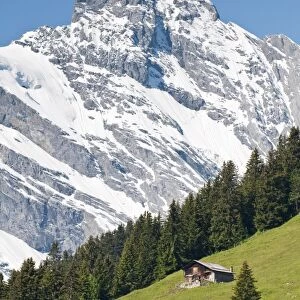 Jungfrau massif and Swiss chalet near Murren, Jungfrau Region, Switzerland, Europe