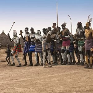Karo people with body paintings participating in a tribal dance ceremony, Omo River Valley, Southern Ethiopia, Africa