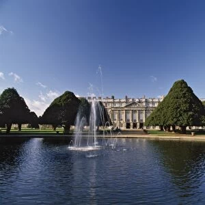 Lake, fountain and ornamental trees in Hampton Court Palace grounds, near London