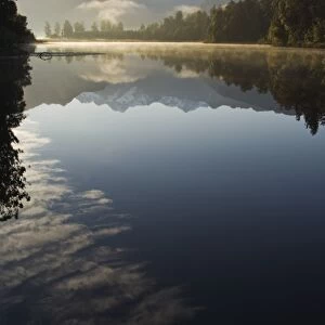 Lake Matheson reflecting a near perfect image of Mount