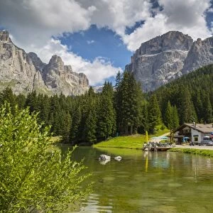 Lake near Hotel Lupo Bianco Wellness and Walking Canazei, Passo Pordoi with mountain backdrop