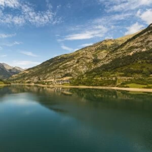 Lanuza lake and village and Pena Foratata peak in the scenic upper Tena Valley, Sallent de Gallego