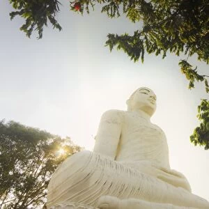 The large 27m Buddha statue at Sri Maha Bodhi Viharaya temple on Bahirawakanda Hill overlooking the city, Kandy, Sri