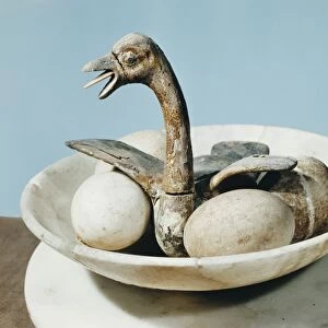 Lid of an alabaster jar decorated with a bird in a nest and eggs in a bowl