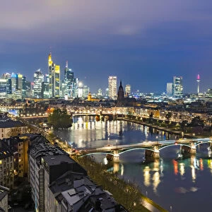 Lights of the Skyline of Frankfurt business district reflected in River Main at dusk, Frankfurt am Main, Hesse, Germany Europe