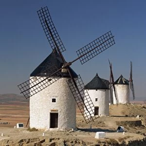 A line of windmills above the village of Consuegra