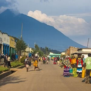 Little village before the towering volcanoes of the Virunga National Park, Rwanda, Africa