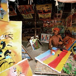 Local artist with his Tingatinga paintings, Zanzibar, Tanzania, East Africa, Africa