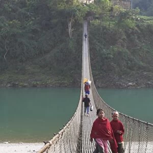Local people crossing the 160m long suspension bridge