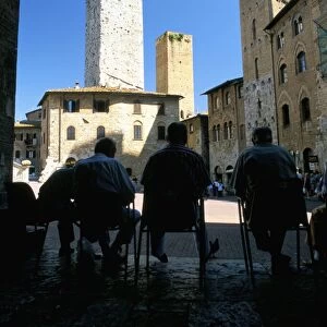 Locals enjoying the shade in the Piazza del Duomo