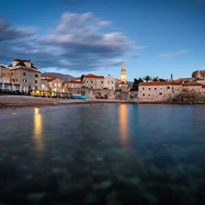 A long exposure during the evening blue hour of the beach and stari grad (old town) of Budva