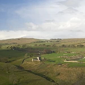Looking west over Roman settlement and fort, Vindolanda, with the Roman Wall on the skyline