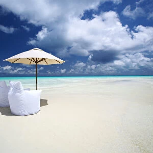 Two Lounge Chairs and Parasol on empty Beach, The Maldives, Indian Ocean, Asia