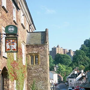 Luttrell Arms Hotel and Dunster Castle beyond, Dunster, Somerset, England