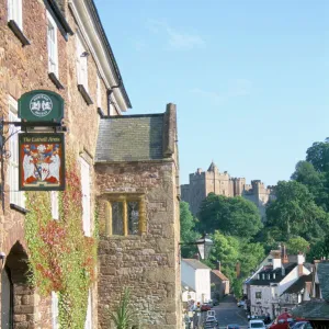 Luttrell Arms Hotel and Dunster Castle beyond, Dunster, Somerset, England
