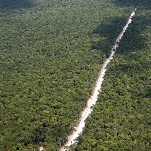 Main highway of Guyana cutting through the rainforest, Guyana, South America