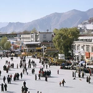 Main square in front of Jokhang, Potala palace beyond, Lhasa, Tibet, China, Asia