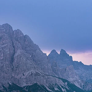 Majestic rocks of Three Peaks of Lavaredo during a pink sunrise, Dolomites, South Tyrol, Italy, Europe