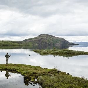 Man fishing at Thingvallavatn lake, Thingvellir (Pingvellir) National Park, UNESCO World Heritage Site, Golden Circle, Iceland, Polar Regions