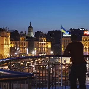Man looking at Independence Square (Maydan Nezalezhnosti), Kiev, Ukraine, Europe