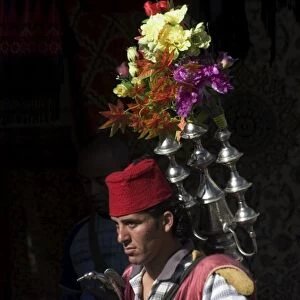 Man selling tea in traditional costume